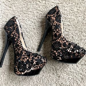 Black lace and nude spike platform heels